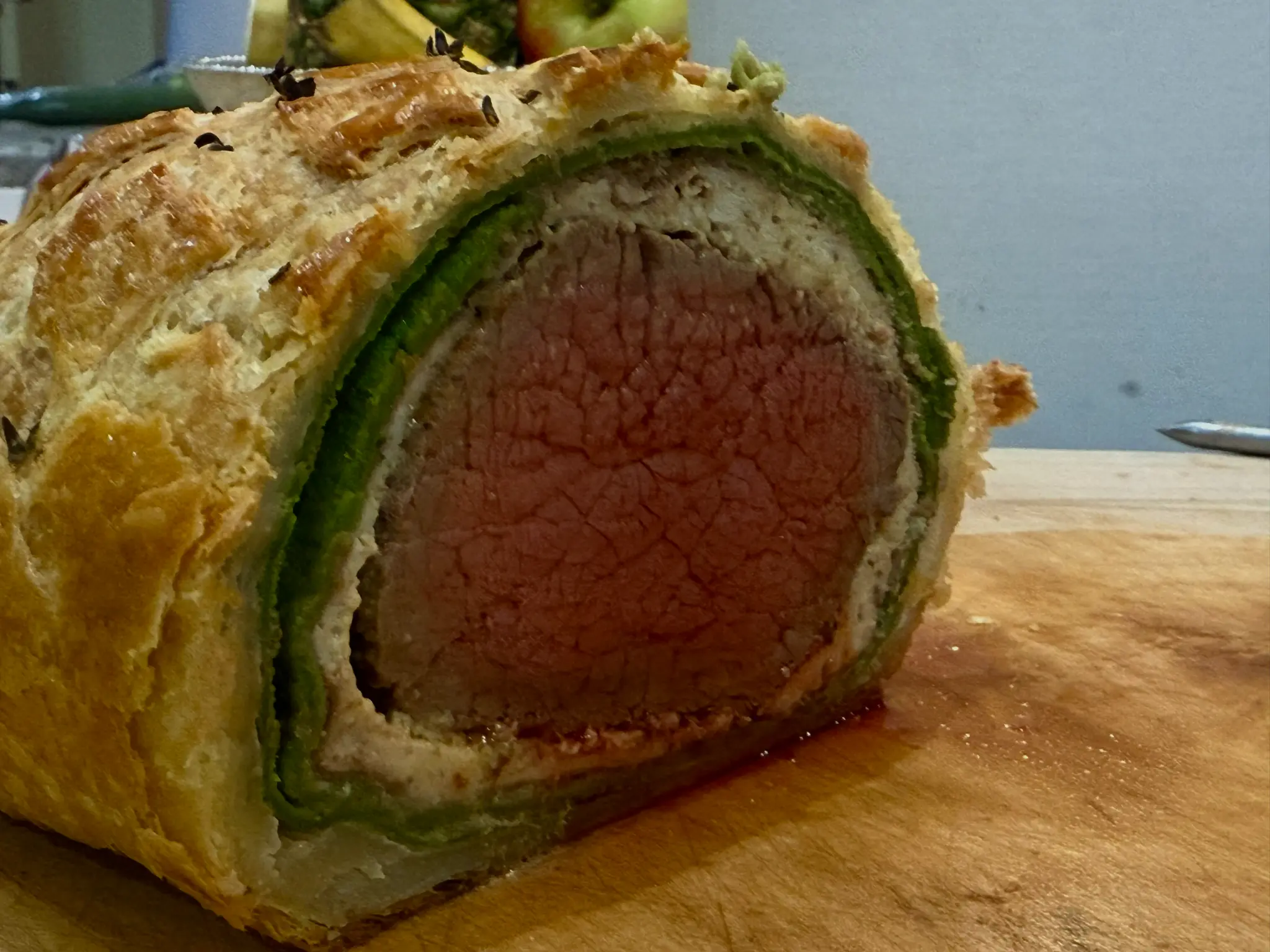 Beef Wellington cross-section showing perfect medium-rare